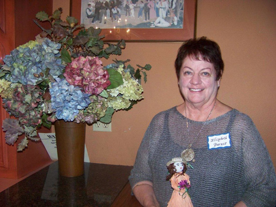 Member with bouquet of flowers