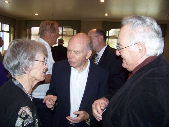 Group of three guest in conversation 