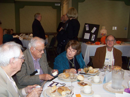 Guest at luncheon table enjoying food