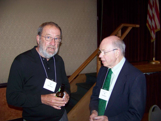 Two gentlemen standing at the 2013 Saint Patricks Day Luncheon looking at the camera