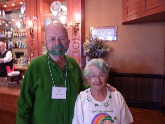 Two standing and smiling Attendees at the 2013 Saint Patricks Day Luncheon